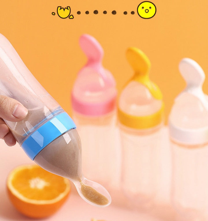 Baby Feeding Bottle With Spoon, designed for easy and mess-free feeding, made from BPA-free materials and ideal for liquids or purees.